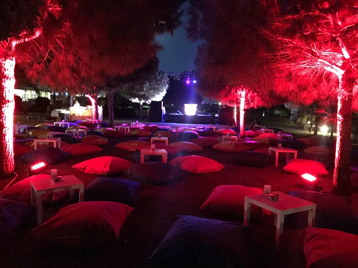Outdoor concept party decoration featuring lounge seating, floor cushions, atmospheric lighting and styled event layout for a night celebration in Antalya, Bodrum and Cappadocia