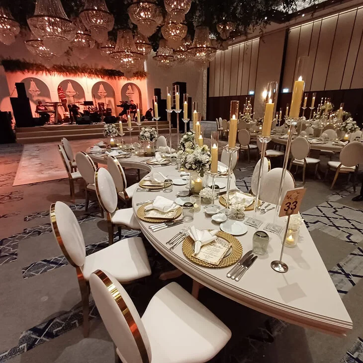 Elegant banquet table design with coordinated table settings, floral centerpieces and candle decor prepared for a formal event in Antalya, Bodrum and Cappadocia