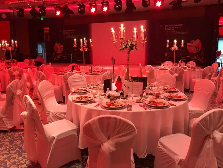 Luxury event table design and banquet decoration with elegant table settings, chair covers and candle centerpieces for a formal dinner event in Antalya, Bodrum and Cappadocia