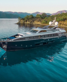 Crewed luxury yacht charter in Turkey with a modern superyacht cruising along the Turkish Riviera