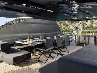 Luxury yacht deck in Bodrum, Turkey featuring elegant outdoor dining, premium lounge areas and a private yacht rental experience