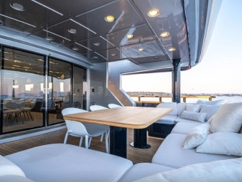 Luxury yacht outdoor lounge in Marmaris, Turkey featuring a spacious relaxation area with panoramic sea views and an exclusive private yacht charter experience