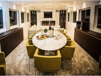 Luxury yacht private dining in Fethiye, Turkey featuring an elegant indoor dining area, premium hospitality and an exclusive yacht charter experience