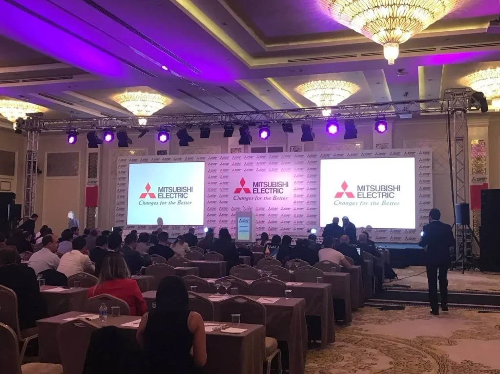 Corporate meeting in Antalya, Turkey with branded stage, presentation screens and seated attendees
