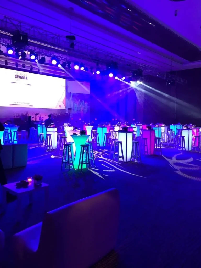 Corporate event setup for an 800-guest company party in Antalya, Turkey with illuminated tables and stage lighting